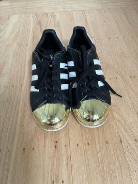 adidas Black Sneakers with White Stripes and Gold Shell Toes